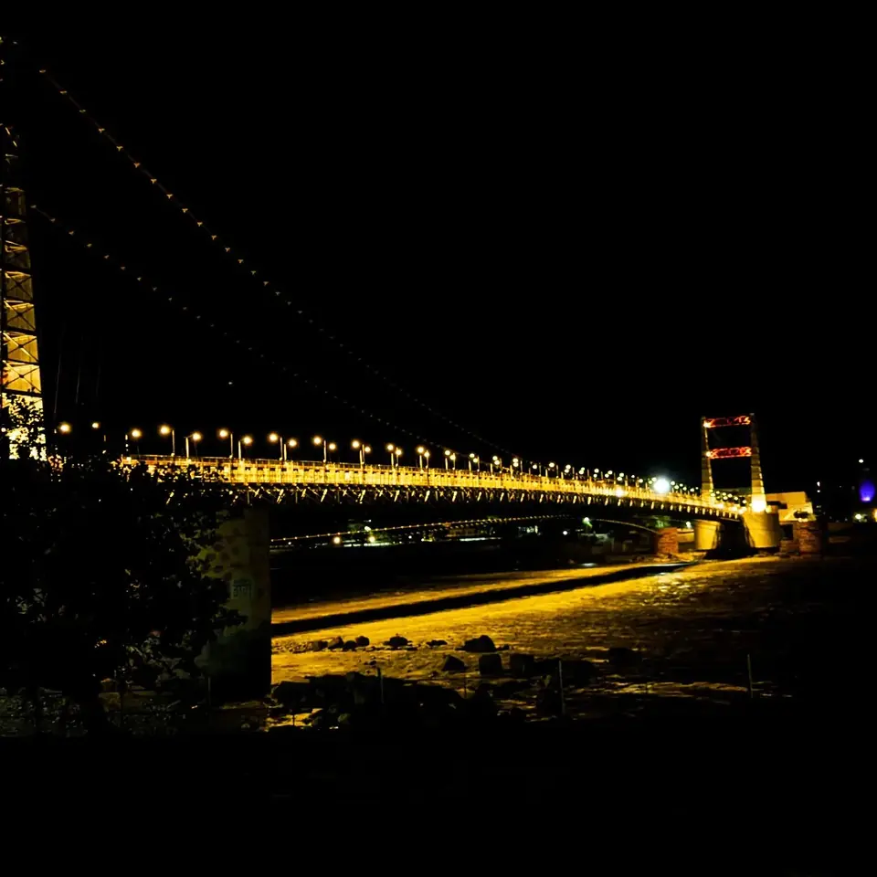 Rishikesh after dark — the bridge glows long after the crowds go home.
